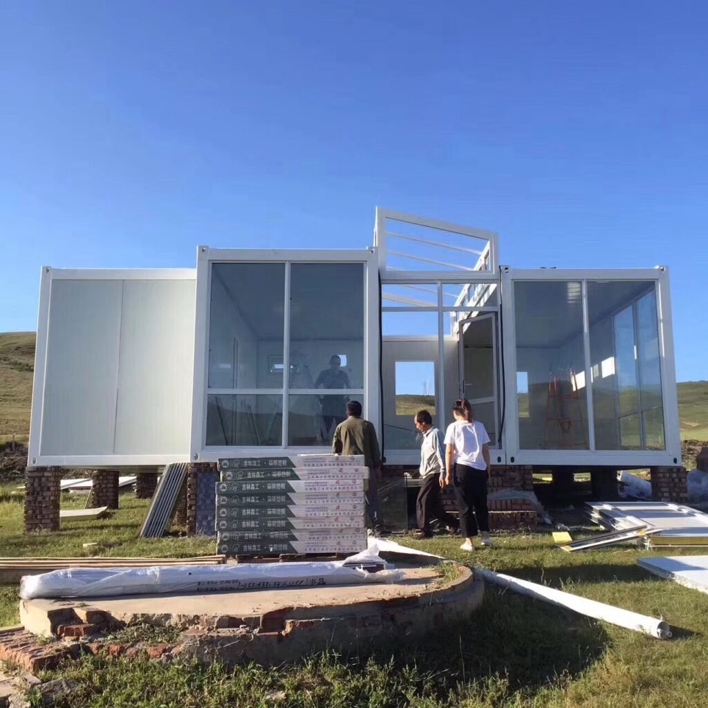 u shaped container home with glass